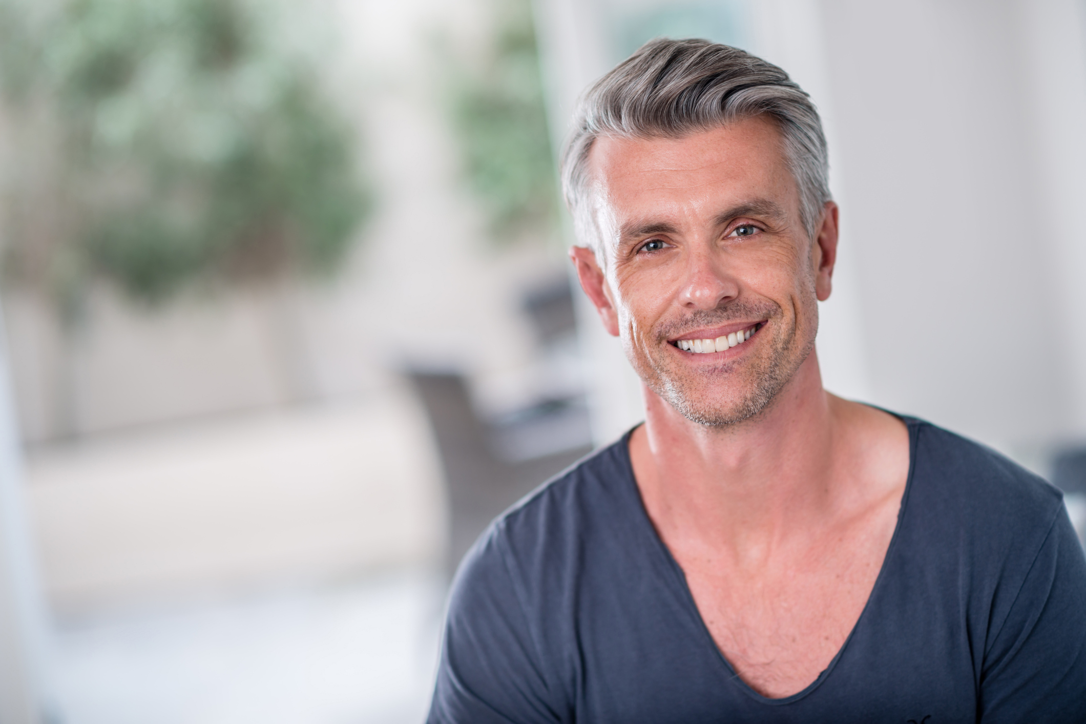 Hair Transplant Correction in Columbus & Dublin, OH: Smiling man with gray hair